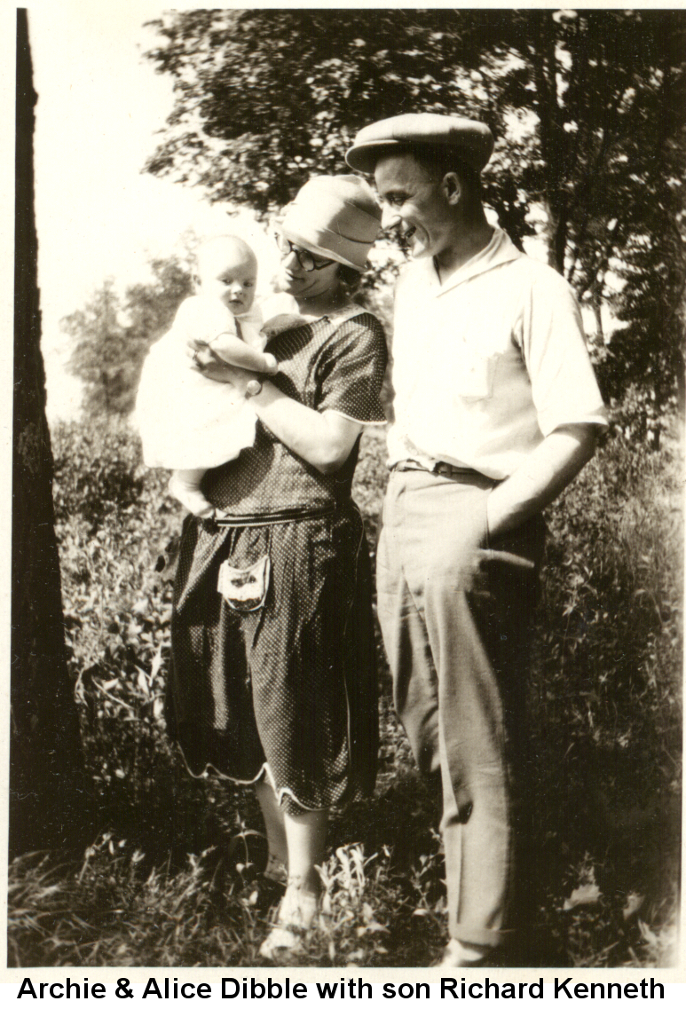 Black and white photo of Archie Dibble in white short-sleeved shirt and flat cap and Alice Dibble with black-framed glasses, hat, and knee-length skirt and blouse; Alice is holding baby Richard Kenneth Dibble in a white baby dress.